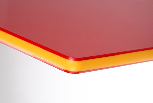 Red-Yellow-Red Ekon plastic sheet manufactured using co-extrusion