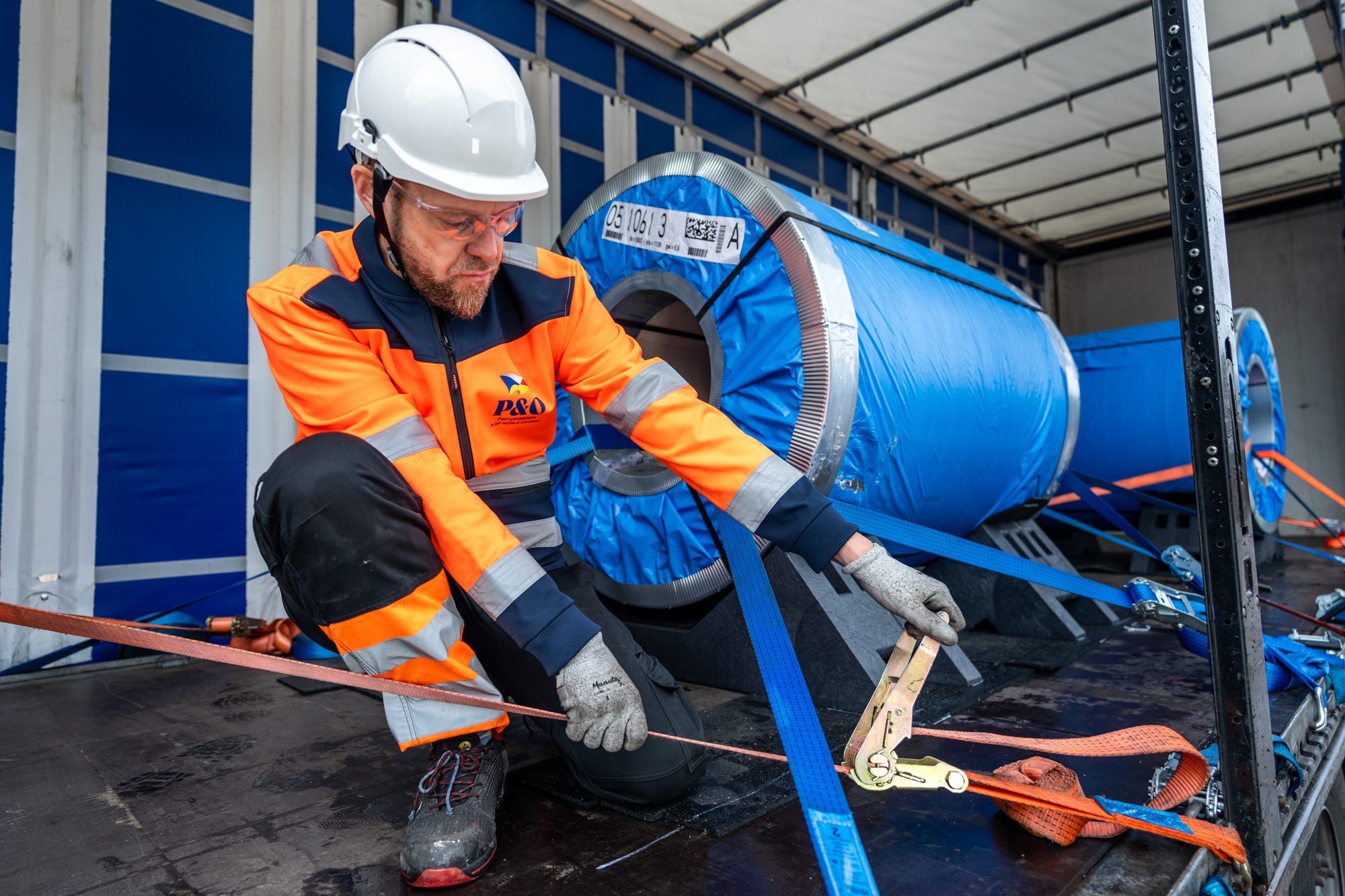 Safe steel coil transport on flatbed semi-trailer with KLP® Coil Transport Cradle