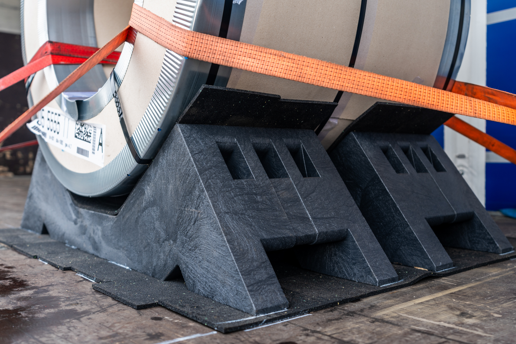 KLP® Coil Transport Cradle securing steel coils on flatbed semi-trailer